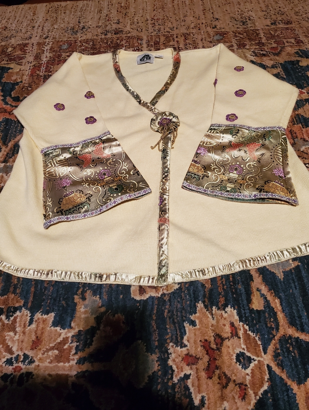 Storybook Knits Cream V-Neck Sweater with Gold Satin Trim and Floral Embroidery